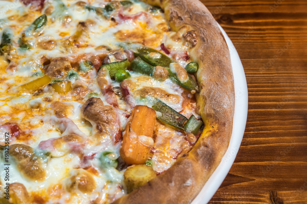Hot delicious pizza freshly cooked in a cafe Hot delicious pizza freshly cooked in a cafe