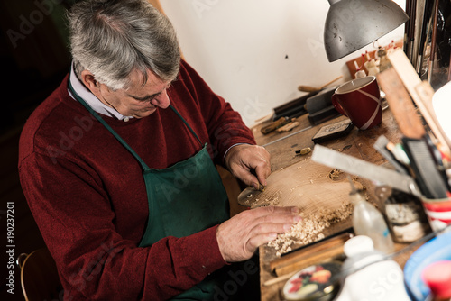 Obraz na plátně instrument maker working in his workshop