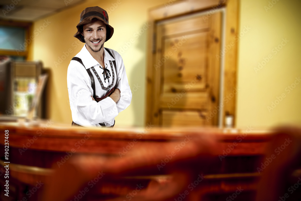 Bavarian man and his own small business. Hotel interior. Bavarian man and his own small business. Hotel interior.