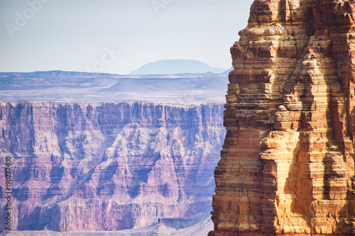The side of a cliff in the Grand Canyon with copy space to the left.