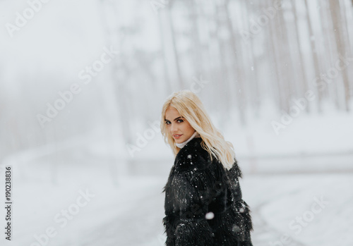 Pretty young blonde woman a...