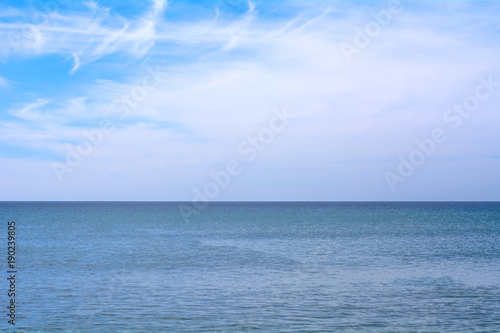 Beautiful sea and sky and clouds is bright white background.
