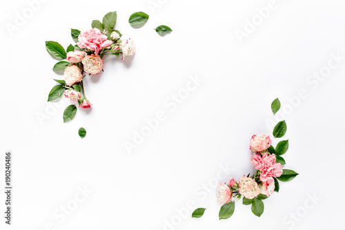 Fototapeta Naklejka Na Ścianę i Meble -  Border frame with pink rose flower buds branches isolated on white background. Flat lay, top view. Floral background. Floral frame. Frame of flowers.