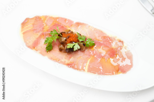 Salmon carpaccio with rocket salad
