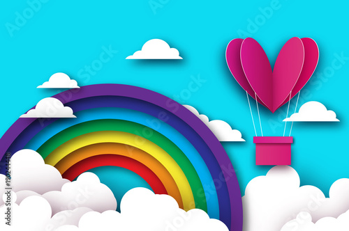 Heart shape Pink hot air balloon flying. Love in paper cut style. Origami Valentine day. Romantic Holidays. 14 February. Be my valentine. Blue sky with origami clouds and rainbow.