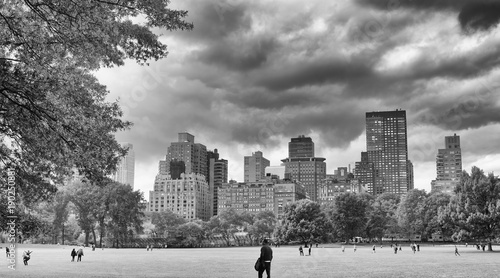 NEW YORK CITY - OCTOBER 25, 2015: Central Park in Autumn with tourists. The city attracts 50 million people every year
