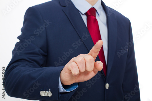 Business man finger touching empty virtual screen isolated on white background. Selective focus and copy space