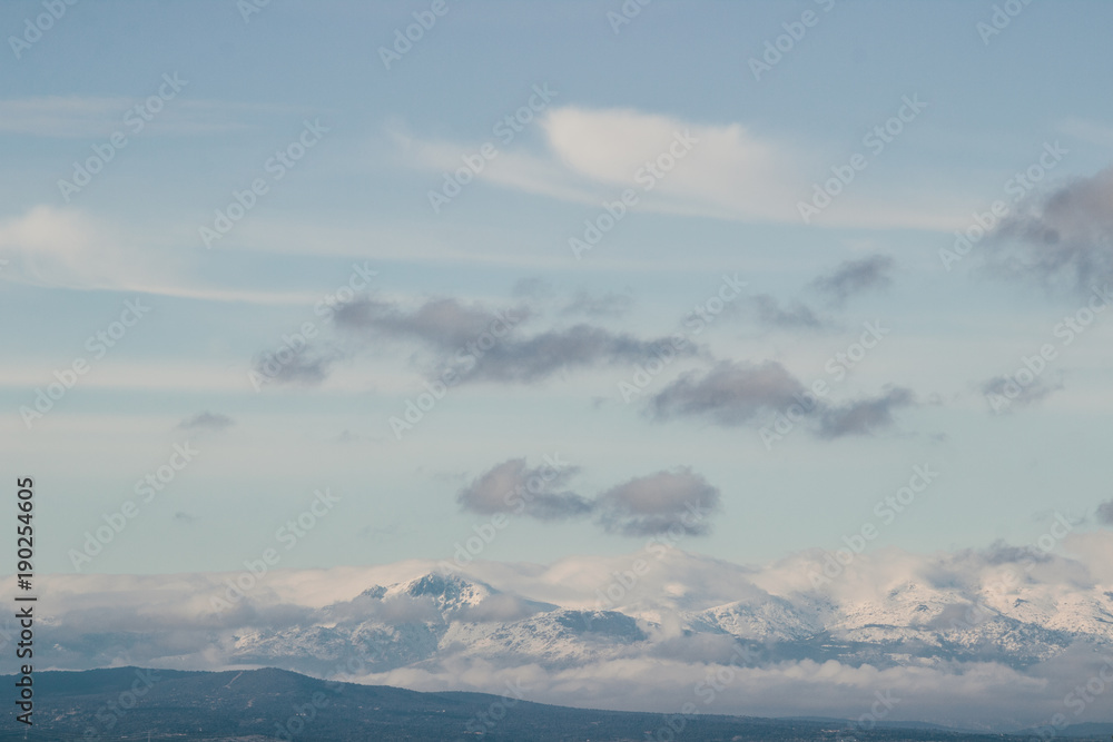 Panoramic picture of the morning fog around the snow covered mountains in Madrid