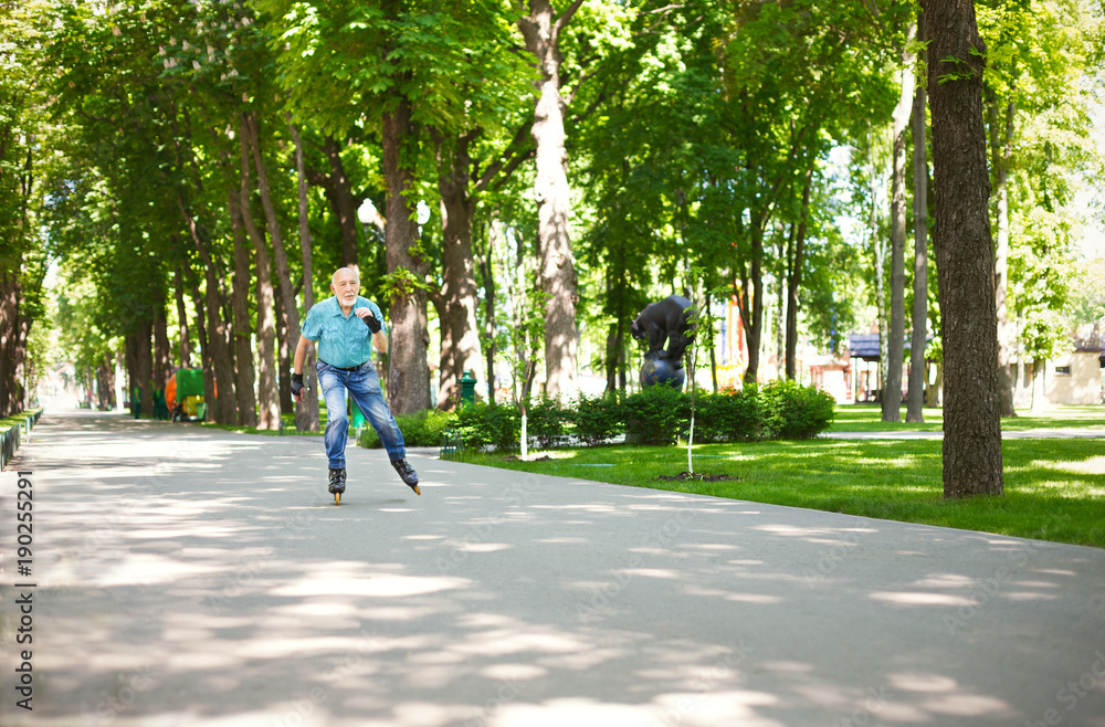 Senior man roller skating outdoors