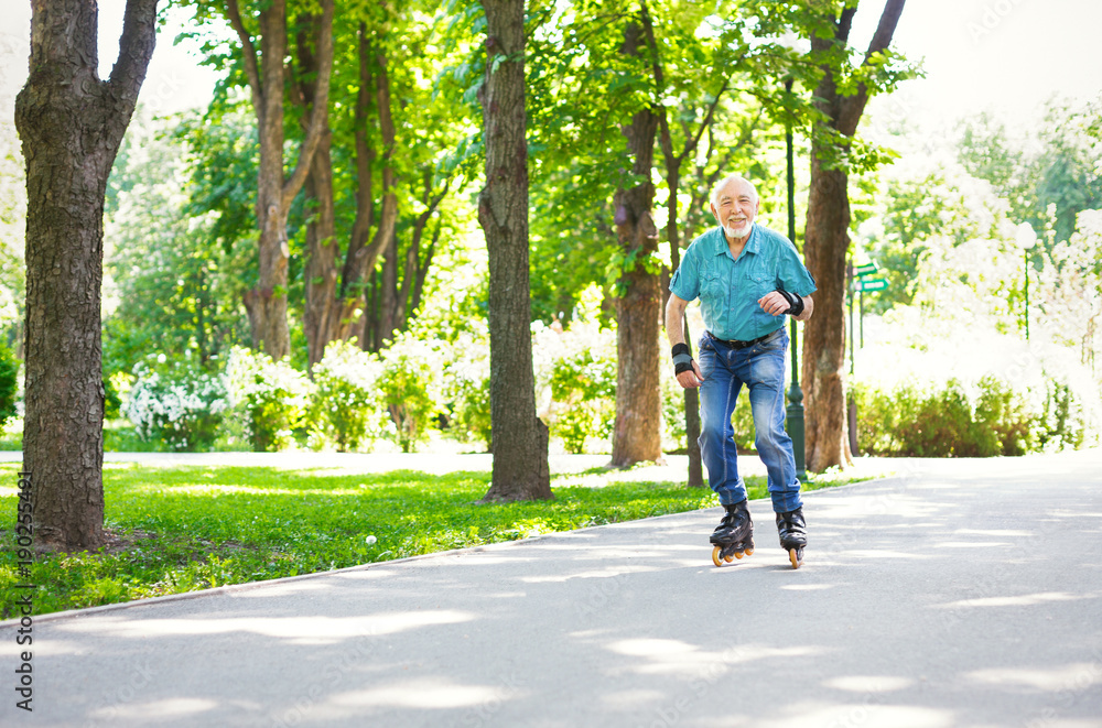 Fototapeta premium Senior man roller skating outdoors