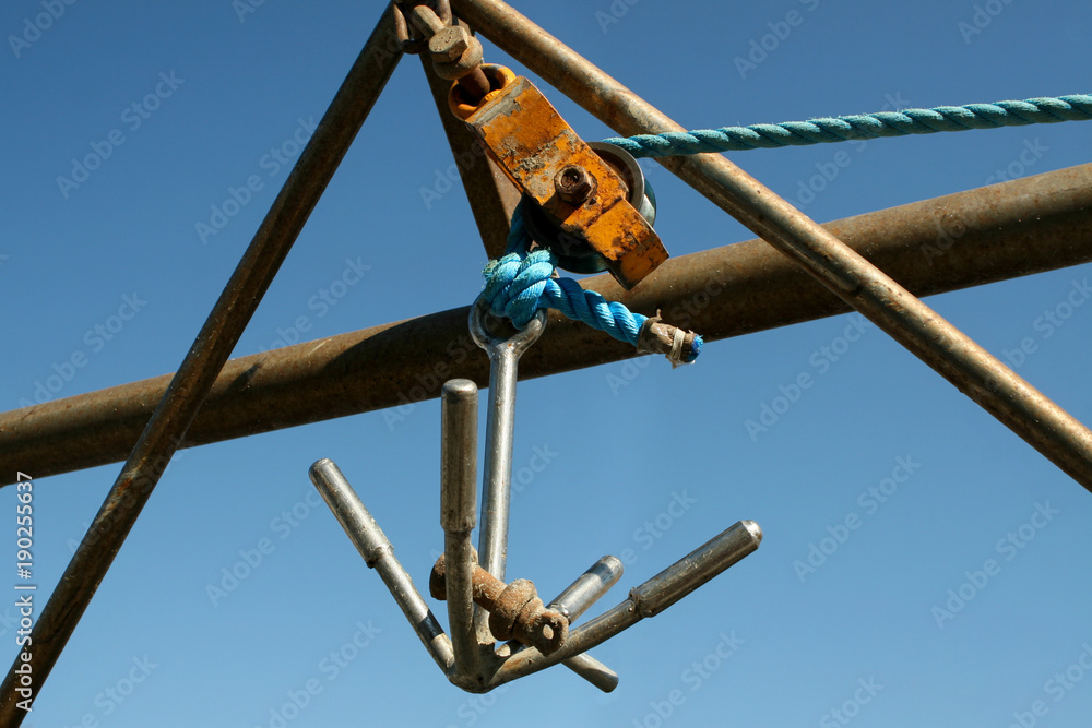 Summer. Italy. Cesenatico. Museum of the ships. Hook on a fishing schooner Summer. Italy. Cesenatico. Museum of the ships. Hook on a fishing schooner