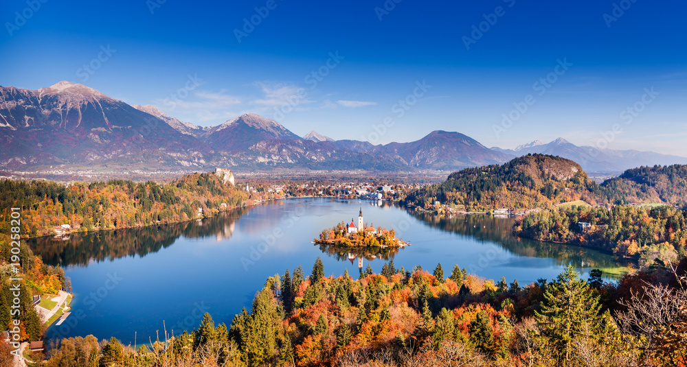 Amazing view on Bled Lake, Island, Church And Castle with mountain range in the background. Top view Bled, Slovenia, Europe