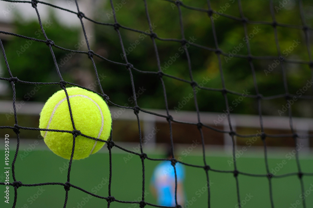 Close up Tennis ball hitting to net