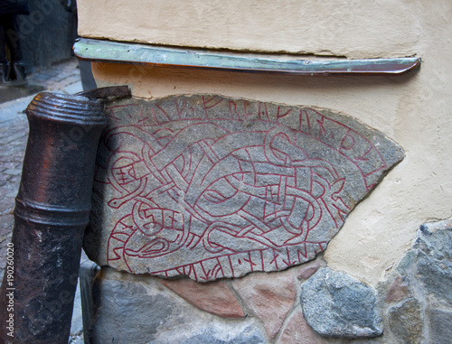 Photography Old runestone built in a wall in old town of Stockholm