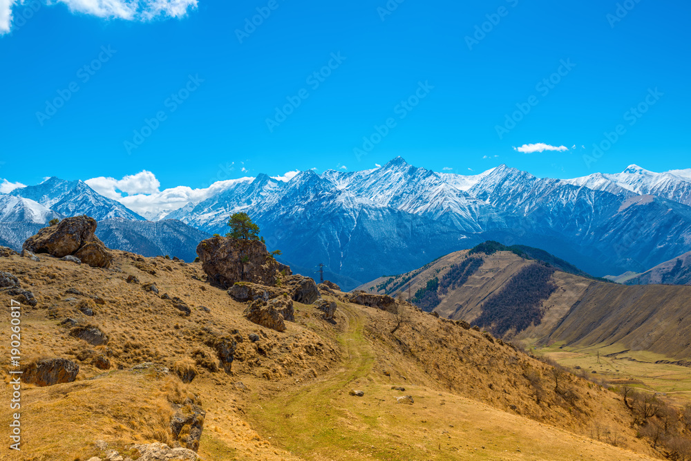 beautiful spring day landscape with snow covered peaks of Caucasus mountains, Russia, Republic Ingushetia, close up