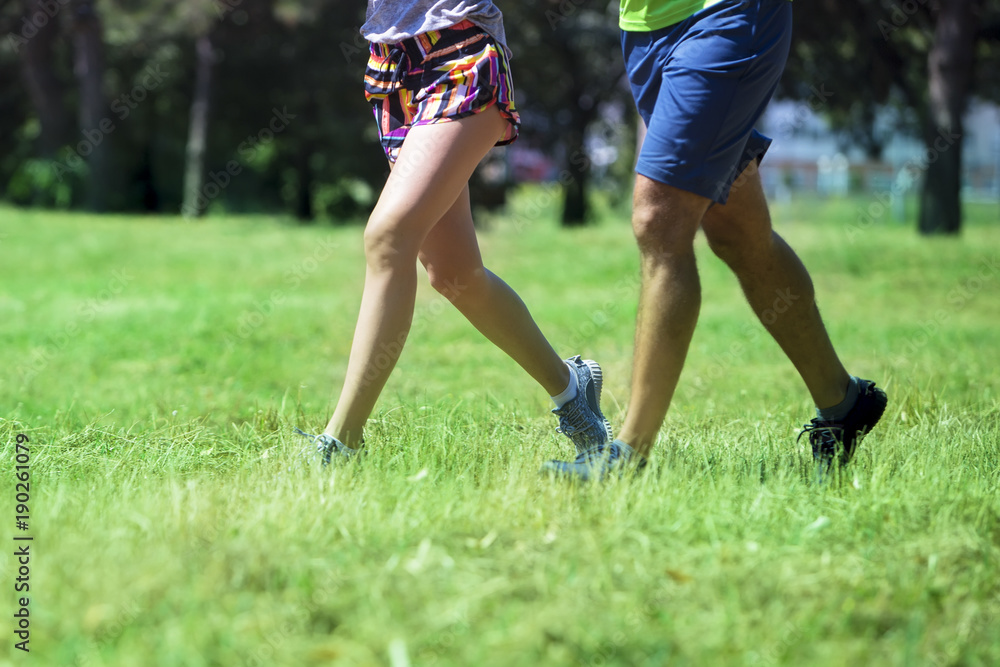 Young couple jogging at the green environment Young couple jogging at the green environment