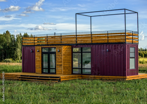 A modern design of a country home constructed from containers. Container houses.