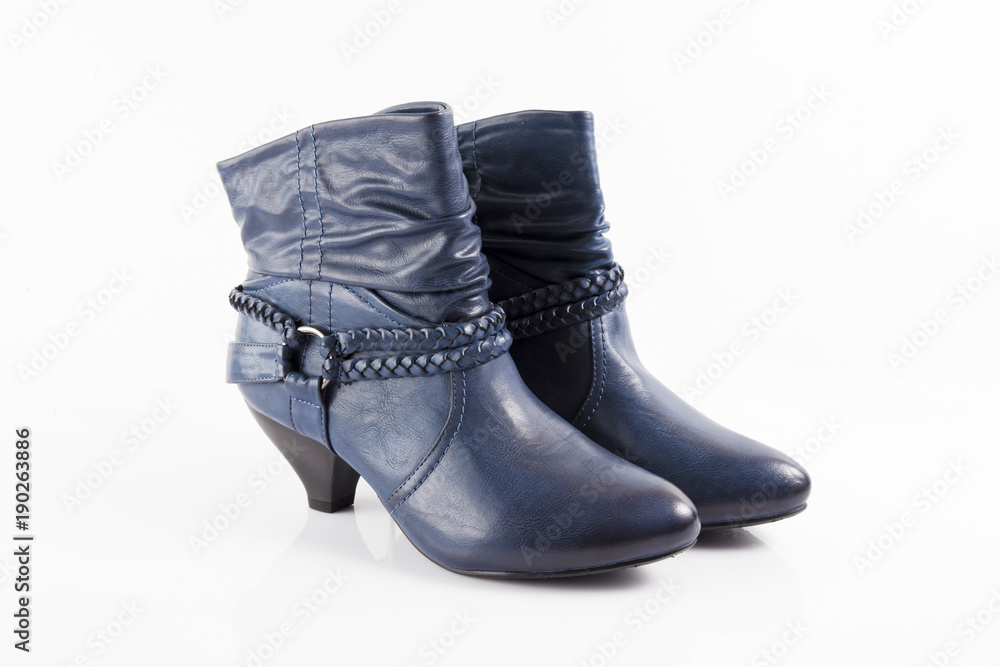 Female blue leather boots on white background, isolated product, comfortable footwear. Female blue leather boots on white background, isolated product, comfortable footwear.