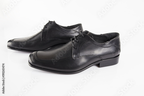 Male black leather elegant shoe on white background, isolated product, comfortable footwear. © GeorgeVieiraSilva