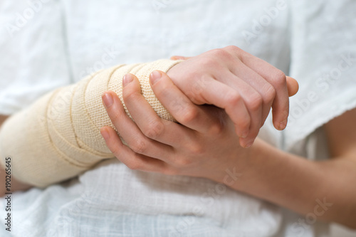 Obraz na płótnie Child arm with elastic bandage on it.