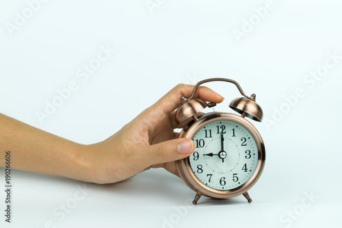 hands holding Vintage alarm clock