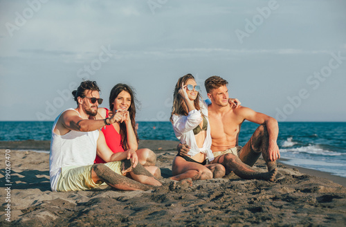 Group of friends together on the beach having fun. © Mediteraneo