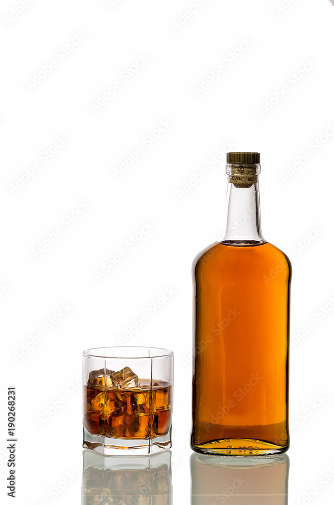 a glass of whiskey with ice isolated on white background a glass of whiskey with ice isolated on white background