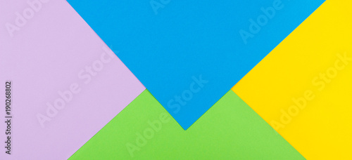 Abstract geometric paper background. Yellow, blue, green and purple colors.