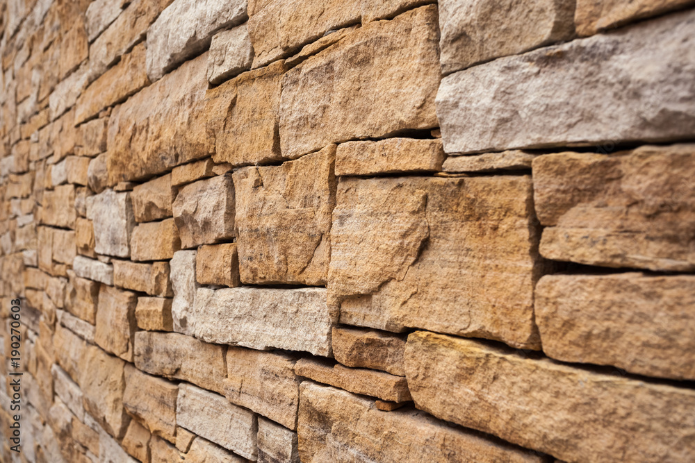 Fototapeta premium Stone wall background Wall made of cavern rock