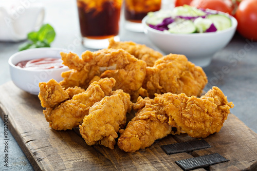 Tableau sur toile Breaded chicken tenders with ketchup