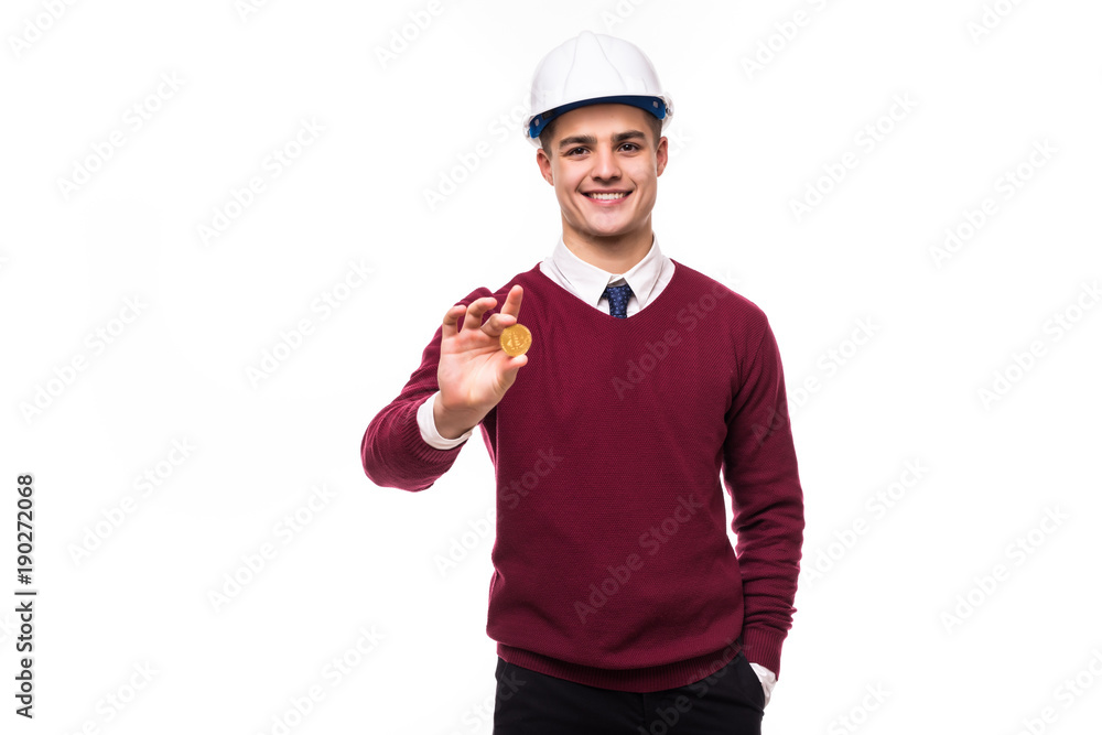 Handsome man miner in protective hemlet with bitcoin isolated on white background Handsome man miner in protective hemlet with bitcoin isolated on white background