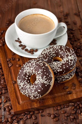 Fresh homemade donuts and coffee mug © amberto4ka