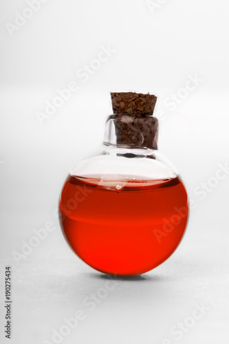 blue liquid in old style vial