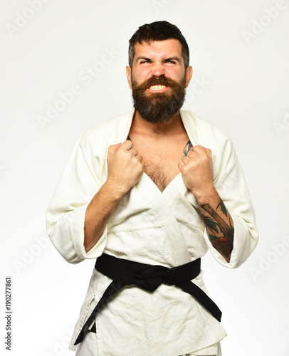 Karate man with angry face in uniform. Jiu Jitsu master