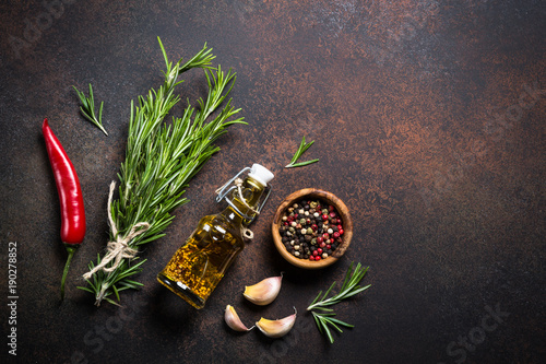 Fototapeta Naklejka Na Ścianę i Meble -  Selection of spices and herbs on dark rusty table.