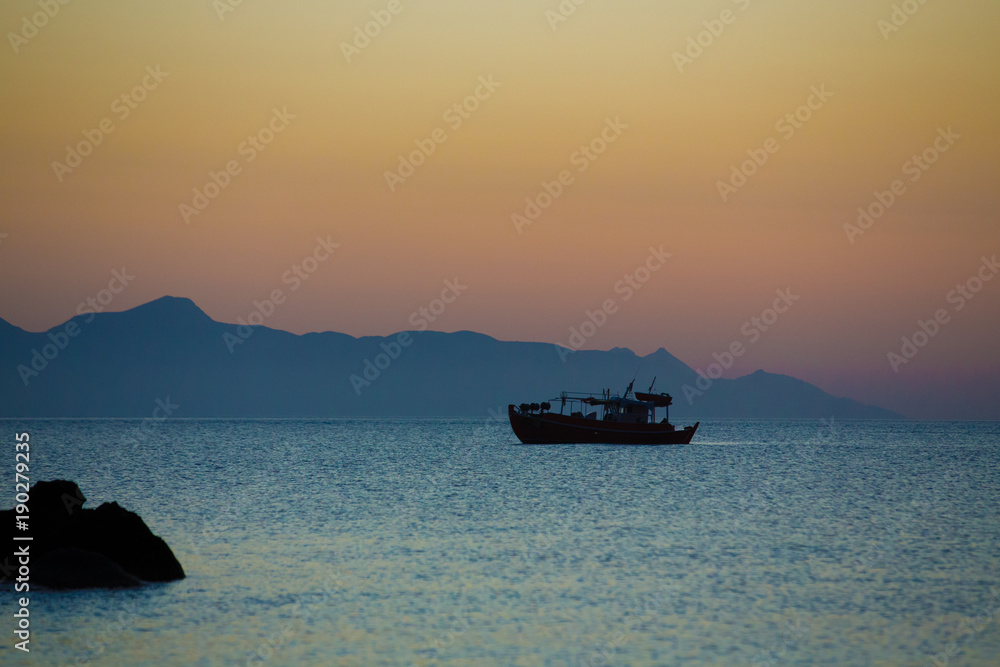 Fishing boat in the sea at night