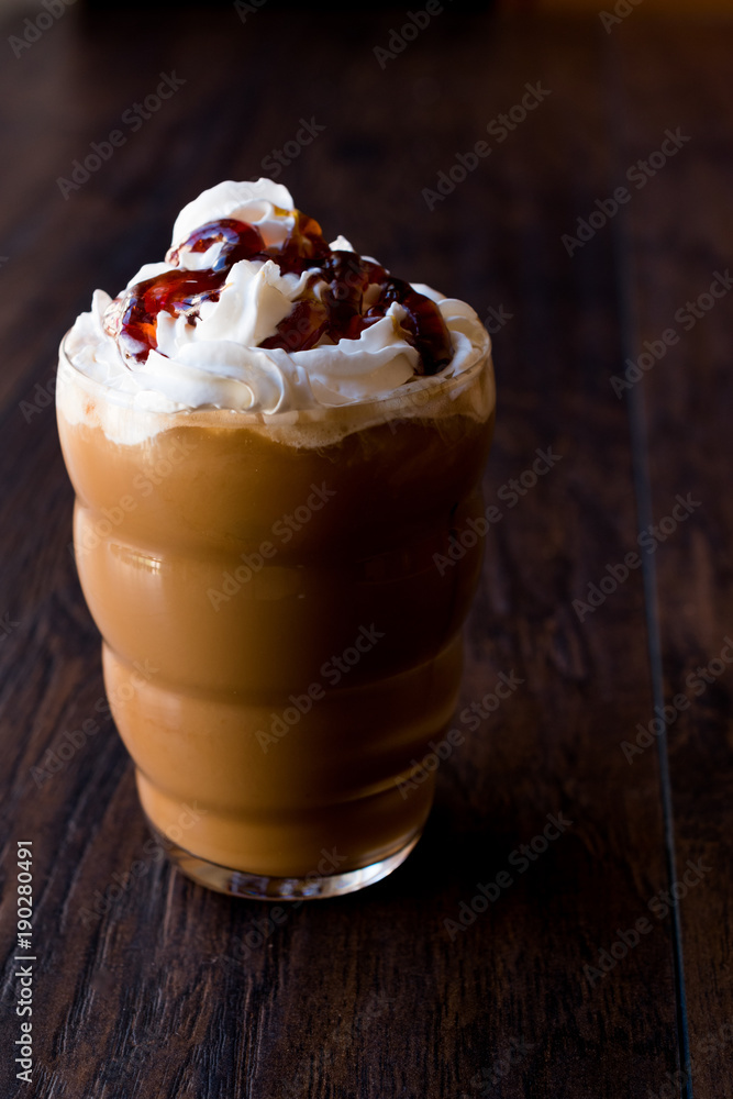 Iced Coffee Caramel Frappe / Frappuccino with Whipped Cream and Caramel Syrup.