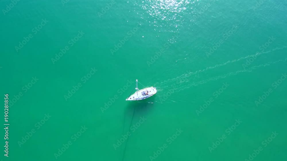 Sailboat sailing through the mediterranean sea. Aerial view Sailboat sailing through the mediterranean sea. Aerial view