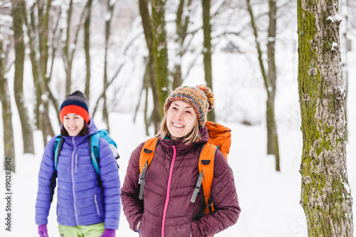 two girls go on a hike in winter