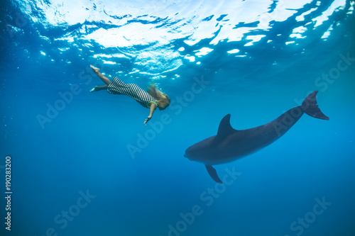 Fototapeta Naklejka Na Ścianę i Meble -  little blonde girl in sea water underwater