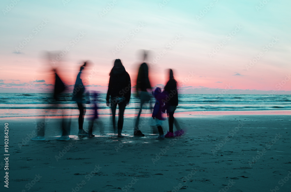 Blurred people on the seashore