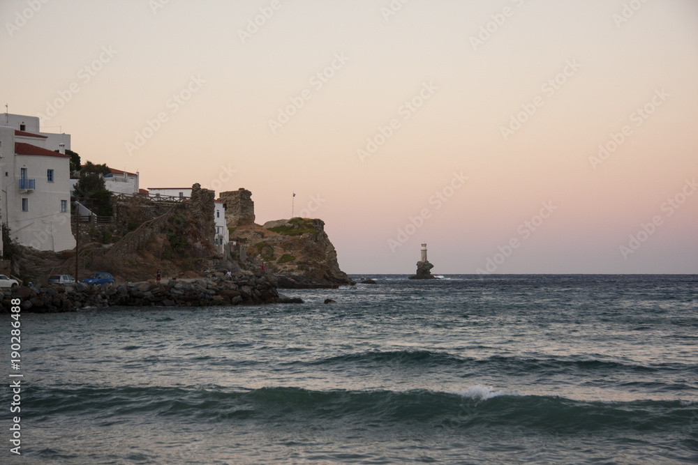 Villag and shore and light house, sunset Andros Villag and shore and light house, sunset Andros