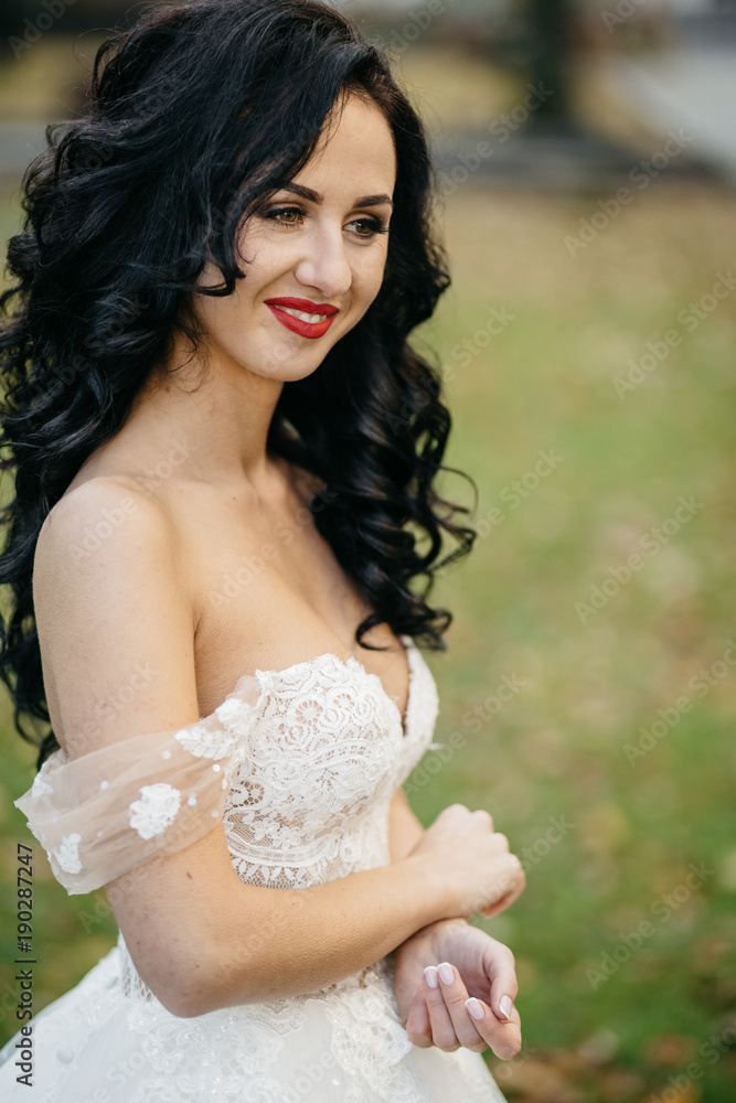Beautiful bride in elegant white dress posing Beautiful bride in elegant white dress posing