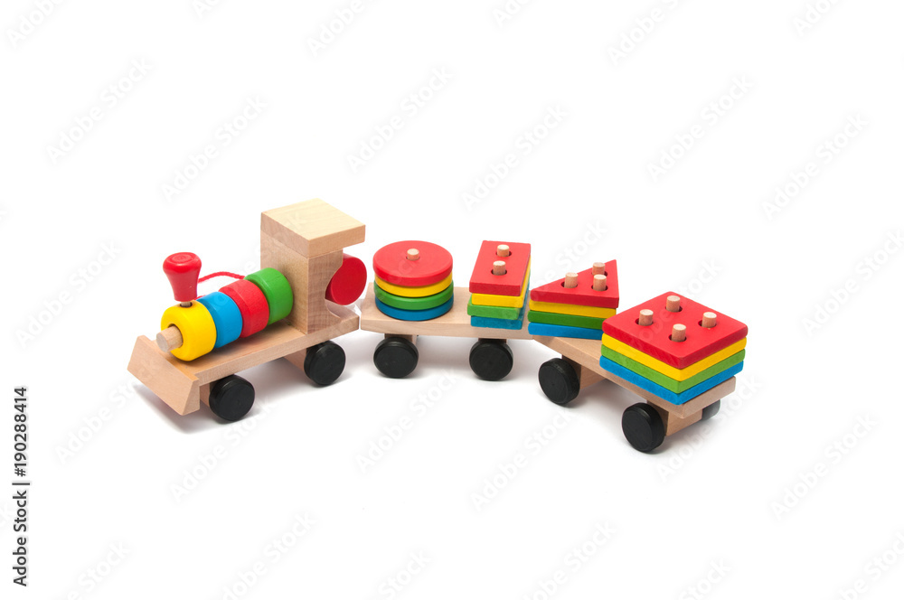 Obraz premium wooden toy children sorter with small wooden details in the form of geometric shapes