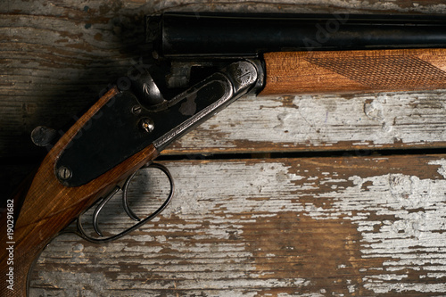 Принти на полотні Hunting shotgun riffle on old rustic wooden table