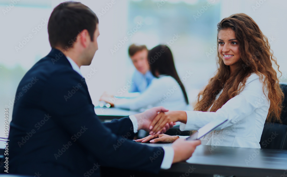 © ASDF - Salesman shaking hands to clients. © ASDF - Salesman shaking hands to clients.