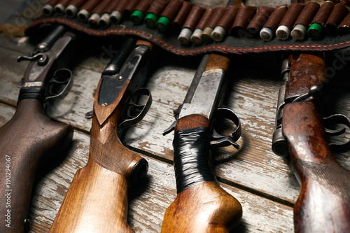 Hunting rifles with leather bandolier with ammunition