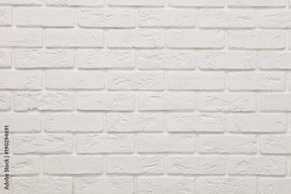 textured wall of white brick. Background. Texture. Design textured wall of white brick. Background. Texture. Design