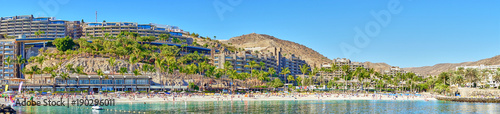 Anfi beach with palm trees and turquoise bay / Gran Canaria in Spain photo