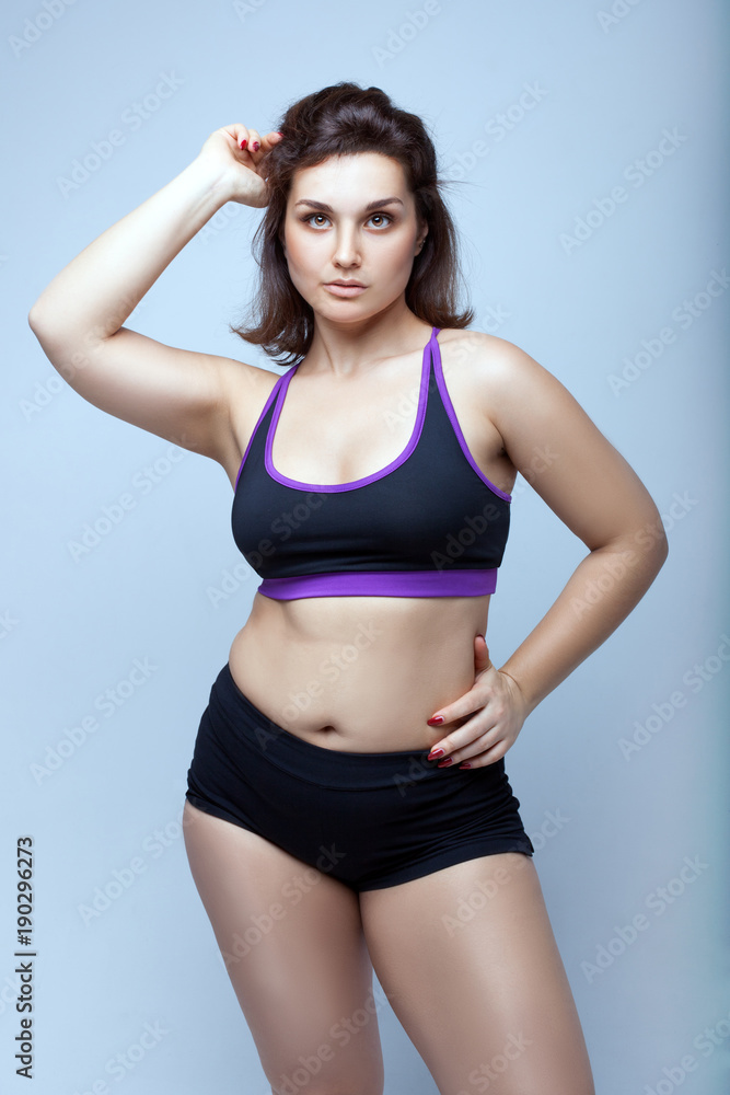 Fototapeta premium Plump girl in sportswear.
